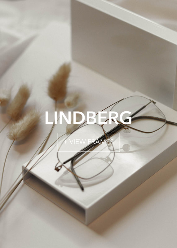 lindberg-final1_3 Lindberg minimalist eyewear on white box, styled with fluffy dried grass. Elegant design.